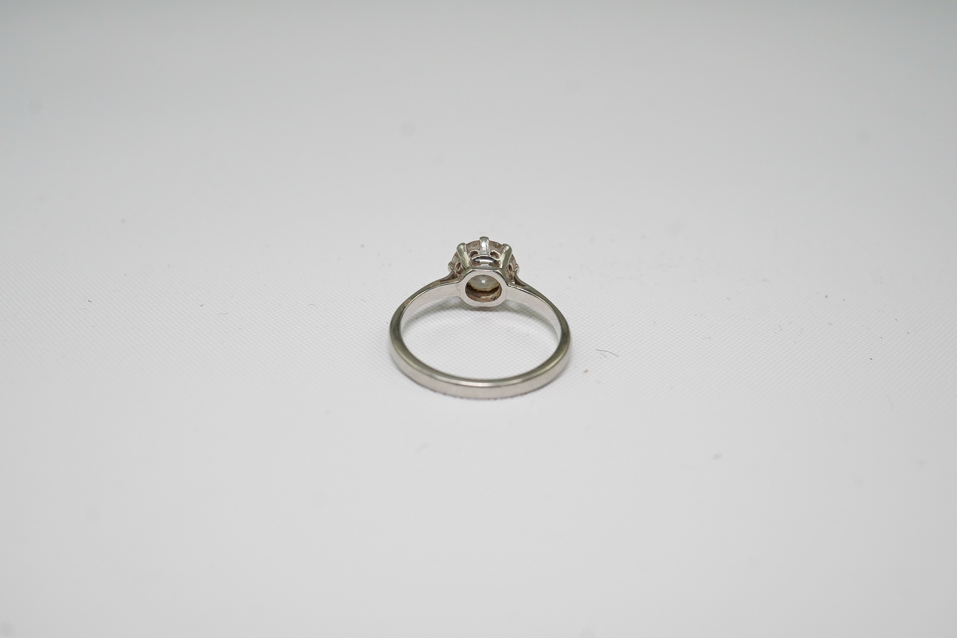 A platinum and solitaire diamond set ring